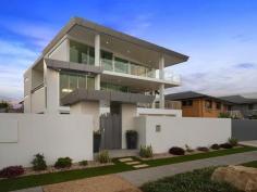 115 Margate Pde, Margate - Waterfront Properties Redcliffe ULTIMATE IN LUXURY LIVING This luxurious masterpiece will impress from start to finish. Boasting the perfect location, this architecturally designed and built home offers outstanding vistas and a waterfront lifestyle second to none. Properties of this calibre and location are rarely offered to the market. Move in and enjoy being surrounded by the absolute quality this immaculate residence offers…… not to mention waking to the sound of waves rolling gently onto the foreshore, sunrise peeping over the horizon and the moon shimmering across the bay at the close of play …….. just amazing. The user-friendly design features high ceilings and spacious light filled rooms with a floor plan that spans 3 levels of designer brilliance, this home ticks every box. Providing the ultimate in executive entertainment with a full wet bar and pool room flowing onto the extensive deck, where you will spend hours enjoying the endless views across the bay or alternatively, move to the sanctuary of the media room to choose from a full range of entertainment options. The huge feature packed gourmet kitchen leaves nothing to be desired. Including a massive island bench ideally positioned to take in the glorious bay views. Miele appliances including dishwasher, 900mm induction cook top, steam oven, plate warmer and microwave with an abundance of storage. The third level master bedroom epitomises luxury with extensive bay vista pouring into the room, massive open area ensuite and WIR. A further three double sized bedrooms, all with large WIRs, a second ensuite, main 2 way bathroom/ensuite and powder room provides for all the family and guests with ease. Massive 674sqm of luxuriously appointed living Additional Features: - Huge home office - The basement level has space for all the toys, including up to 8 car spaces with large storage room, second laundry and powder room. - Very Low maintenance, fully landscaped block with a 23,000 litre inground, concrete water tank. - Ducted air throughout - Polished timber staircases - Huge well appointed laundry - Vacuum maid - Intercom - Security alarm system - Water and power to all balconies - Efficient Heat pump hot water system - Provision, plans and approval for lift and pool. From this gorgeous home, stroll in either direction for kilometres without leaving the sandy shores of the bay. Perched on arguably the premium strip of beach on the Peninsula, this home is simply …….the ultimate in luxury waterfront living. Property Code: 590