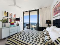 1202 / 99 MARINE PARADE, Redcliffe - Waterfront Properties Redcliffe Penthouse in Mon Komo's Residential tower! Your Redcliffe Peninsula ‘Sea-change’ awaits you! If you’ve always dreamed of upmarket apartment living right in the heart of Redcliffe, then you simply must add this Penthouse to your short-list! Situated in a quiet location on the top floor of the classy Mon Komo separate Resident’s Tower, you will enjoy magnificent south-facing views that encompass the gorgeous city and Port of Brisbane night lights. This 148m2, two-bedroom plus study apartment is exquisitely presented so you will be able to envisage just moving in and enjoying the huge open-plan living area – which comfortably accommodates the largest of dining settings to entertain family and friends. However, due to the superb location, you are more likely to be wandering down the street to enjoy the many cafes and restaurants in the heart of Redcliffe, visiting the popular lagoon with the grandchildren or simply strolling the gorgeous waterfront taking in the fresh sea air! Bluewater Square (which hosts Woolworths, BWS, a pharmacy, Doctors surgery, etc.) and public transport is just a few metres from the Mon Komo complex, so you’ll find that such a convenience. You’ll also enjoy the facilities that Mon Komo itself offers – two pools, gym, hotel, restaurant and accommodation for guests. It really is all about LIFESTYLE… You’ll never feel so relaxed as you will moving into an easy ‘lock-up and go’ apartment with no yard or house maintenance to worry about. This Penthouse has the added bonus of having 7m2 of lock-up storage along with two car spaces in the secure ‘residents only’ basement carpark. So if you are not quite ready to part with some of your treasures, then you’ll have great storage for them… Check out some of the features of Unit 1202: • Two great-sized bedrooms • High-end bathroom and ensuite • High ceiling and very spacious living area • Great-sized kitchen with high-end Miele appliances and gas cooking • Separate laundry • 2 secure car spaces + 7m2 storage • Indoor + outdoor pool + gym in complex • Impressive entrance foyer to resident’s tower • 25 minutes to Brisbane airport • Stunning bay, city and Peninsula views All this for Offers over $899,000! You really must come and see why this Penthouse is so special. Call Karen Prince on 0437 015 951 to arrange your private inspection now… *** OPEN HOME INSTRUCTIONS *** This apartment is in the 'Resident's Tower, not the Vacation Tower. The entrance is accessed from the Sutton Street side of the Mon Komo complex. There is an intercom system, so if no-one is at the entrance, then push 1202 and the green bell. Otherwise please call my mobile and I will meet you at the doorway.