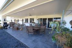 48-54 MARTIN PLACE TAMBORINE QLD 4270 $899,000.00 This amazing 4078 m2 Elevated property is in the Prestige "Riemore Downs" in one of best and ideal locations of Tamborine Village. This particular property boasts stunning views of Tamborine Mountain and the surrounding Ranges. This Architect Designed home was created by the current owners, who did not plan to leave so soon, as it is less than 12 months old. Reluctant as they are, this will be to your benefit, as money was not spared in the making it literally a "Dream Home". Loads of Bells and Whistles as you walk around the five bedrooms, all with built in robes, the master with walk-in and ensuite, the spacious well designed open plan kitchen, has stainless steel appliances with a 900mm Gas stove with Fan Forced oven, Stone bench tops and a very efficient walk in Butler's Pantry. The open plan living has thoughtfully set up three separate living areas, offering you a large family room and lounge that leads out to the Alfresco with a great entertainment and BBQ area. Light and Airy with reverse Cycle Split Systems Air Conditioning as well as ceiling fans throughout the complete house. Back to the Grid 6klw Solar power keeps the bill very low. Simple low maintenance design Landscape with a 16m x 9m Colourbond Shed, with plenty of room for a pool or a larger shed should you desire. You will be impressed by this home and not disappointed. Airconditioning, Broadband, Built In Robes, Courtyard, Dishwasher, Ducted Cooling, Ducted Heating, Ensuite, Fully Fenced, Grey Water System, Open Spaces, Outdoor Entertaining, Pay TV, Remote Garage, Rumpus Room, Secure Parking, Shed, Solar Hot Water, Solar Panels, Water Tank, Workshop,
