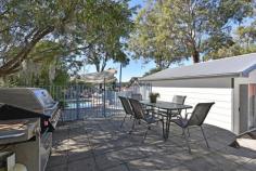 7 Asquith Avenue Windermere Park NSW 2264 $480,000 - $510,000 A leafy address plays host to this charming single-level home set on amongst well-tendered gardens and effortlessly blending its traditional cottage appeal with modern touches. With well-scaled proportions, a free-flowing layout and large picture windows catching pretty views, the home unites broad entertainer appeal with an inground pool being a terrific outdoor centre-piece. A flexible two-bedroom design with a large living space, generous sunroom and separate one-bedroom sleep-out off the garage provide every essential for complete comfort. – Stylish living room finished in mondern tones and warm timber flooring – Practical kitchen with good storage, electric cooker and dishwasher – Versatile sunroom framed by leafy views over the lengthy backyard – Outdoor appeal with alfresco areas, a naturally set pool and lovely gardens – Two bedrooms with robes, bathroom with separate shower and tub – One-bedroom sleep-out with air-conditioning and bathroom – Secure single garage with extra parking bays in the driveway – The beautiful inlet of Lake Petite is an easy stroll – just a block away – Boating, boat ramps, fishing and swimming all at your fingertips..