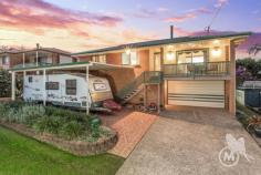 20 Girrah St Brendale QLD 4500 Presenting a loved and cared for family home of one owner. If you’re wanting space, entertainment and family time areas, then come and see this property for yourself. What this home has to offer your family, makes everyone’s lifestyle easy. Upstairs is your main bedroom as well as three generously sized bedrooms all with built-in’s, a beautifully renovated bathroom including a laundry chute for convenience and function as well as a separate toilet. Relax in the combined lounge and dining area to watch TV as the fireplace is lit up to warm you in the cooler months. This room provides two entry points and also flows out to a front balcony, within this room, the dining area directly facing you is an open close passing plate point to the kitchen bench of the king size smart and function-able kitchen and dining room next door, holding an all you can stack (please-able) walk in pantry. As you make your way downstairs through the internal wooden staircase you have another bathroom and toilet as well a second room currently being used as a fifth bedroom. The laundry is huge, with all the cupboard space you require for all the needs of a large family. Downstairs displays a deluxe space of entertainment including a large bar, pool table and joined sitting/games area that flows through to the massive outside hub with a large built in brick barbecue.This truly holds a wonderful presence for entertaining that cater’s for multiple families, celebration or occasion. But wait there is more! A wonderful enclosed private luxurious spa that seats eight people, a well sized man’s shed and plenty of room for the children to play, what more could you want within this property for your family. See you at the Open home!