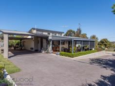 23 Wortley Road Greenmount Greenmount WA 6056 $499,000 Discover how it feels when everything is “just right”. Hidden behind an established garden and set towards the end of a cul-de-sac, this 4 bedroom, 2 bathroom, plus study brick and iron home has an aura of understated chic and oh-so-easy living. Impeccably presented indoors and out, raked ceilings with exposed beams and highlight windows deliver light, airy spaces while honey-toned timber and gold-flecked granite create an instant welcome. A decked alfresco entertaining area edged with manicured gardens and a water feature expand the functional living space and deliver a home that is family-friendly and move-in ready. 4 bed 2 bath plus study 1977-built brick & iron Open plan kitchen/meals Airy sunken lounge room Quality windows & blinds Timber floors & cabinets Easy indoor-outdoor flow 5 Kw array solar panels Impeccable 855 sqm block Close airport and Midland The sense of entering a private retreat is immediate as you make your way up the paved driveway to the welcoming front porch and stylish alfresco entertaining deck. A faultless exterior, timeless design and quality fixtures ensure this property will elicit a long, relaxing exhale and the realisation you have found a home that is “just right”. Garden views, a calming water feature and city glimpses give the covered deck an irresistible pull and lead you into the light-filled, open plan kitchen/meals and sunken lounge. High ceilings with exposed beams and German-engineered, double-glazed windows highlight the solid style credentials of this memorable property. Louvered, highlight windows add to the luminosity of the gold-flecked granite benchtops and Anigre timber cabinetry. A 5-burner hob, 900 mm oven, dishwasher and large pantry create a kitchen that is as functional as it is stylish. Tall windows fill the sunken lounge/family room with garden views and create a space that feels both cozy and spacious. A built-in bookcase and timber floors add to the sense of comfort and style, while high ceilings create a feeling of openness. The main bedroom and adjoining office are arranged at the front of the home and open to a private pergola-covered terrace. The main suite features a large built-in robe and ensuite with shower, vanity and W.C. Three good-sized junior bedrooms – one with a surprisingly large walk-in robe, two with built-ins – share a family bathroom. A walk-through laundry leads to the rear of the home where a large carport – with space for 4 cars – and a series of raised garden beds bordered by two garden sheds. Grey paving edged with a tidy lawn wraps back to the alfresco deck to expand the functional outdoor space. The spacious deck, surrounded by a low clipped hedge, offers ample space for both seating and dining. Overhead fans, an elevated position and city glimpses create a relaxed mood while direct access to the kitchen delivers seamless indoor-outdoor living. Situated within easy reach of the services and amenities of Midland, the beauty and outdoor adventures of the Perth Hills this home is a short drive from the airport and offers access to a choice of schools. Don’t hesitate, come and discover what it’s like when everything is “just right”...