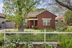 3 Churchill Avenue Glandore SA 5037 $625,000 to $655,000 If you’ve been on the hunt for a character home with a big private back yard and room to grow, you can stop looking. With its picture-perfect gated herringbone paved driveway, manicured lawn and garden beds and classic red brick façade, you’ll be hard pressed not to fall in love with this 1938-built Deco cottage before you’ve even stepped inside. And when you do, a beautiful entry laden with polished timber floors and door frames leading to a well-lit front living room with modernised combustion heater will ensure any reservations you had are well and truly left at the front door. You’ll adore the wonderfully well-lit kitchen which is proudly positioned in the center of the home; its timber bench tops, electric cooking, subway tile splash back and skylight combine with the subtlest of mint green walls for a personal and homely feel. Family meals or entertaining will be equally enjoyable in an adjoining dining room with open fireplace. Three bedrooms are on offer; a spacious front master with ceiling fan and built-in robes, second also with robes and third enjoying a soaking of natural light at the rear. Serviced by an updated main bathroom with shower/bath and separate w/c. A beautiful sunroom provides a wealth of extra storage and bench space and access to the rear verandah where your endless backyard begins. Little legs will appreciate the substantial lawn area, behind which a large workshop awaits in addition to a big shed, ready to cater for space-demanding hobbies. More? – Fire pit – Solar panels – Long gated carport – Ceiling fan to living room – 986sqm (approx.) block with plenty of room to extend – 5000 ltr rain water tank Located a short stroll from the Glandore Oval and Playground, bus stops and Emerson Railway Station, with schooling and other amenities including the tram all within easy reach. Specifications: CT / 5715/244 Council / City of Marion Zoning / Residential / 17 – Residential Character Built / 1936 Land / 698 m2 approx Frontage / 15.24 m Council / $2,141.65 pa SA Water / $223.58 pq ES Levy / $153.65 pa..