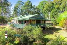 148 Ridge Rd Central Tilba NSW 2546 $690,000 "Kennocha" - Not far from Central Tilba and a short drive to Mystery Bay with its many pristine beaches, is this lovely home set on approximately 7 acres. Relax, sit on the covered veranda and enjoy the surrounding bushland with an amazing amount of birdlife and animals. The Home: High ceilings with hardwood beams, timber floors, open plan living, dining and kitchen. Lots of large windows and doors leading onto the wrap around veranda. Three good sized bedrooms, central bathroom, separate toilet and spacious laundry are located at the rear of the home. Access is via steps at the front, near level entry at the rear or a ramp leading onto the side veranda for those who cant handle stairs. Power is connected to the home plus there is solar hot water and eight panels to lessen your electricity account. Water storage, approximately 90,000 litres. Acreage: 2.67 hectares approximately with some fencing. There is an established orchard, macadamia, olive, and many other fruit trees. From Ridge Road, there is a gently sloping driveway leading up to the home, shed, caravan and the carport. Caravan: Ideal for extra visitor accommodation when those unexpected guests turn up to enjoy your rural piece of paradise. A carport has been built over the caravan for protection and comfort in the warmer summer months. Rustic Workshop: Art Space, Man/Woman Cave, Games Room, Workshop, Craft Room etc. Make this space what you want it to be. Location: Located close to Corunna Lake, not far from Central Tilba and a short drive to Mystery Bay, Narooma or Bermagui.