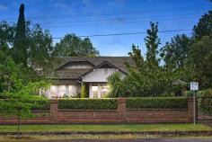 129 Webster Street Lake Wendouree VIC 3350 $2,600,000 - $2,700,000 Set amongst idyllic green gardens and mature trees on a private 1300sqm block is this enchanting period home, only metres from Lake Wendouree. One of Ballarat's most coveted locations, Webster Street is a tree-lined avenue of heritage homes and historic charm. The house was designed and built by Architect Wilfred Coltman in 1928 and retains the superb period features of the era combined with the conveniences of modern living. The original areas of the home feature wood panelling and coffered ceilings, along with solid wood doors set with leadlight glass panels. A formal entrance welcomes you, rich with the tones of dark wood and warmed by polished timber flooring. The formal living at the front of the home is full of period character, overlooking the lush gardens through the big bay window. Sliding doors lead to the huge master bedroom, with its lovely deep sills and open fireplace. The adjoining bathroom is large and beautiful, blending modern tiling and glass shower with old world features such as the clawfoot bath and fireplace. There is also a separate and spacious walk-in robe, completing the master suite. Three other bedrooms also enjoy the elegant features of the period, the largest offering coffered ceilings and a beautiful open fireplace.. Each bedroom has walk-in robes while one also has its own ensuite, which would be ideal as guest accommodation. A fifth bedroom has built-in shelves making it ideal as a possible study. A modern extension at the rear of the home houses the informal living areas. The kitchen is large and modern with new AEG appliances including induction hot plate and dual ovens, a built-in wine rack, large walk-in pantry, electrically operated overhead cupboards and drawers, marble benches and an island bench. There's even room for a double sized fridge. Reverse cycle air conditioning maintains perfect temperature control. The kitchen forms part of an open plan family area with modern dining and living spaces. A wall of windows in the family area offers garden views and glass doors lead out to the huge terrace and outdoor entertaining space with an automatic self-closing, fully adjustable louvred roof. The family living room has windows on three sides, with floor-to-ceiling height windows framing the open stone fireplace and solid cement hearth. Two sets of bi-fold windows can be opened to let the outside room become part of the living space. This is luxury and comfort combined. Throughout the older section of the home are a host of original features including high ceilings, picture rails, wooden mantlepieces, wood panelling, leadlight windows and deep windowsills. Superb light fittings add to the feeling of style and elegance. The modern wing is streamlined and beautiful, making the most of modern touches like downlights and a wine storage room. The home has hydronic heating and a ducted vacuum system throughout. Outside, a three-car garage with remote control door, and connected to water and power, mature trees and a 25,000-litre water storage tank with pressure pump complete the picture. A remote-control front gate and remote sensor lights along the driveway mean you don't have to lift a finger until you're safely parked. This is a distinguished home and a welcoming one. Properties in this area are highly sought after and this property is now offered for sale for only the third time in its life. This is a premier piece of heritage real estate in an ideal location, just a short walk from Lake Wendouree, cafes, hospitals and the finest schools. This is one of Ballarat's finest homes and it could be yours. To arrange a private inspection of this grand old home, contact Tony Douglass on 0418 555 973 today.