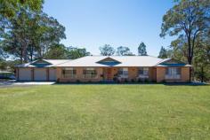 10 Sutton Grove Branxton NSW 2335 $799,000 to $850,000 Land Size: 2 Acre Seated on 2 picturesque acres, 10 Sutton Grove offers the conveniences of town water, NBN, sewer & school bus whilst tantalizing the mind with bush land, open spaces and sunsets atop of mountain views . Beautifully renovated throughout, the home flows from magnificent polished floorboard's to soft plush carpets easy on the eye enjoy the vibrant splash of colour. The warm & relaxing color palette, make's coming home after a long day of work pleasurable. Utilize the 2 expansive living areas all located in the heart of the home - the rear family area is A/C and offers views across the property. A state of the art kitchen offers loads of storage, stone bench tops, led lights, breakfast bar and views to the entertaining area, yard and beyond. All 4 bedrooms have built in robes, with the master bedroom having an en suite and walk in robe. Natural Light is plentiful oozing in from every aspect of the home via beautiful wall to floor windows. This property has 2 driveways - an entry from Sutton Grove, plus an entry from Elderslie Road. At the rear of the property is a large shed with power and water, toilet and laundry, giving you loads of room to park all the toys, attached is a 2 bay carport. The property is fully fenced, including a large dog proof yard at the back of the home. This property wont last long, please call us today to book an inspection: