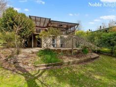 14 CHANGUE ROAD MERRIJIG VIC 3723 $395,000 Located at the base of Mt Buller this charming timber home is built to blend with its alpine environment. Loads of accommodation with a total of 4 bedrooms, 2 bathrooms and 3 living rooms. Recently renovated kitchen with stone benchtops and induction cooking. Bright and modern main bathroom. Spacious main dining and living area opening onto s large outdoor living deck with views across the Delatite River to the mountain forest beyond. Slow combustion wood heating and reverse cycle air conditioning. Downstairs has kitchenette, 2 bedrooms, living room and bathroom enabling self-contained letting to skiers or other season holiday stays. Delightful mature gardens with an abundance of colourful flowing plants.