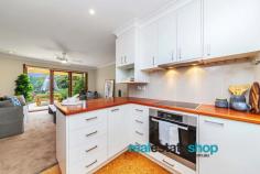 18/15 Wyselaskie Circuit Kambah ACT 2902 $589,000 This environmentally friendly, solar passive home provides the ultimate comfort all year round. The northern aspect, double glazed windows, insulating honeycomb blinds and solar electricity will keep you comfortable throughout Canberra’s four seasons and power costs down to a minimum. Beautifully renovated to the highest quality and perfectly presented throughout, this is a home to simply move in and enjoy. The freestanding design offers that extra outdoor space and this townhouse is surrounded by gorgeous landscaped gardens creating a private leafy oasis, just perfect for relaxing after a hard day or to entertain. Set in a quiet tightly held complex yet close to all amenities, this really is the perfect place to live. Features: *Freestanding single level townhouse with no adjoining walls *An easy short stroll to the Kambah Village shops, public transport, Burns Club, Taylor Primary School and oval *Renovated throughout *Northern aspect *Sun filled living areas *16 solar panels –huge electricity saving! *Double glazed windows throughout *Kitchen features include hardwood timber benchtops, cork flooring, instant boiler tap, Siemens dishwasher, Miele pyrolitic oven, ceramic cooktop and large pantry *Ensuite features include heated flooring, heated towel rails, good storage and disability friendly supports *Eco carpet made partly from sugar cane *Insulating honeycomb blinds and block out blinds *Ceilings fans *Reverse cycle heating and cooling *Double brick garage with internal access * Pet friendly environment *Irrigated gardens and two water tanks to conserve water *Private sun drenched front courtyard surrounded by lush manicured gardens *Quiet complex...