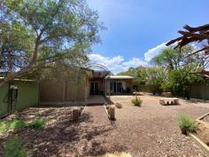 6 Johannsen Street Gillen NT 0870 $450,000 This wonderful home is situated in the welcoming suburb of Gillen and has so much to offer! Sitting on 702 square meters of land, this property has plenty of space for entertaining inside and outside. The front of the home boasts a large drive way, easily accommodating 4 cars and several entry-way's with lockable gates. The kitchen offers spacious benches, ample cupboard space, gas cooking & views of the outside entertainment area. The dining area sits adjacent the lounge area helping blend the living spaces together. The two rooms offer plenty of space for family dinners and relaxing while also having the benefit of two sliding doors on either side of the room, both exiting to outdoor entertainment areas. With so much opportunity to truly make this space your own, the outdoor area to the front of the property sets the scene of this lovely home and is the perfect space for any occasion. This area features several garden beds, an arched walkway leading to a sheltered sitting/reading nook & gorgeous citrus trees lining the fence. The master bedroom boasts large wardrobes, split-system and evaporate cooling, ceiling fan, ensuite and access to the yard through sliding doors. The other two rooms also feature split-system and ducted air-conditioning. The main bathroom is generous in size and incorporates a bath and shower, a full vanity with ample storage and an exhaust fan with fluorescent lighting & heat lamps. The laundry is spacious with large linen cupboards, ample bench & storage space and access to the outdoor area leading to the clothes line. Other features of this property include: • Large garden shed • In-ground clothes line • Fully tiled throughout • Evaporate cooling and split-systems throughout • Ceiling fans throughout...