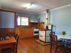 84 CRUMPTON DRIVE BLACKBUTT NORTH QLD 4306 $320,000 This 2 bedroom home with builtins, has polished floors, a woodstove to cook on in winter to keep you warm & an electric stove to cook on in summer. It has 3 ceiling fans, fully screened, and a verandah on 2 sides. The property has a 40x20 lock up colour bond garage, to park 3 cars and a workshop area with power, water , tiolet and the laundry. This property also has a large storageshed/animal shelter , which is 3/4 concreted with a 40x20 fenced area. The block has been selectived cleared with a dam, and is nearly fully fenced , with good fertile soil for growing. It backs onto the rail trail, which is popular as a walking track, horse riding , or push bike riding.