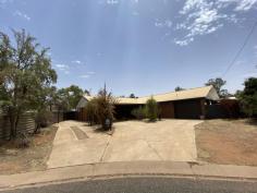 5 Lulba Court Braitling NT 0870 This spacious Braitling home is a renovators dream! This property will be offered by way of auction to be conducted on 25th January at 10:00am. With 5 bedrooms and two bathrooms, there is plenty of room to explore and personalise! The front of the house is open and welcoming with two separate driveways, garden beds and a side gate to access the back of the property. The kitchen offers a huge amount of both cupboard and bench space, separate pantry and serving counter. The dining room sits separate from the kitchen with features including downlights and access to the side passageway through large glass doors. The spacious, sunken living room offers two arched-brick entry ways, pendant lights and so much room to entertain. The master bedroom boasts carpeted floors, a separate study, built in robe AND walk in robe and ensuite. The other rooms are all generous in size and all offer different features including BIR's and even sliding door access to the front of the property. The main bathroom is spacious and boasts a large bath, shower and a double vanity with ample storage space. The outdoor area offers so much potential to truly personalise and make the space your own. Featuring a spacious yard, large in-ground pool, BBQ area, garden shed and undercover entertainment area. This space is perfect for any size family and will be the main attraction.