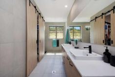 235 Paynters Creek Road Rosemount QLD 4560 $1,275,000 It's a rarity to find a property that offers a unique combination of quiet and peaceful seclusion, multiple lifestyle possibilities and convenience. This expansive, eco-friendly, custom built residence is positioned on 1.7 acres. The quality of this home is immediately apparent; from the spacious entry you are led into the welcoming, large open plan living/dining areas featuring 4.6 metre high ceilings, stacker doors that flow out to a grand alfresco area overlooking the saltwater pool and peaceful bush backdrop, embracing the Queensland lifestyle in complete privacy. This property boasts a stunning kitchen with quality Fisher & Paykel appliances including a pyrolytic wall oven and a 'Gas on Glass' cooktop. Also featured are Caesarstone benchtops, large servery and a butlers pantry with abundant storage and second sink. The home presents with four large bedrooms, all with built-ins, a grand master suite with walk-in robe and an impressive fully tiled ensuite boasting double vanities and a double shower. Cleverly designed, your family will have options galore with an additional media room/office, lounge/rumpus area, a games room with custom built-in bar, internal laundry with ample storage, two further luxurious bathrooms, separate powder room, three car garaging and a custom designed shed. The versatile floor plan could easily be set up for dual living. Located in a sought-after dress circle acreage belt just 5-15 minutes to Bli Bli shopping village, private schools, beaches, river, Sunshine Plaza and Sunshine Coast Airport - the location provides quick, effortless access to everything you need. No expense has been spared on fit out and build, and everything is of the very highest quality. This property must be inspected to understand its scale and beauty. Private, 1.7-acre parcel Eco-friendly, custom designed residence Stunning 78,000L saltwater swimming pool Lavish stone kitchen with separate butlers pantry Flexible layout, can easily be set-up for dual living Large open plan living & dining areas flooded with natural light 4 bedrooms, media/office, games room & second lounge/rumpus 3 fully tiled bathrooms with stone benches throughout 3 car garaging + a 56sqm. custom designed shed Secure, fully fenced backyard Separate powder room 6.6kW solar system 2 x 12.5kW ducted & zoned air-conditioning systems 2 x 22,500L in-ground concrete water tanks 2 x gas instant hot water systems...