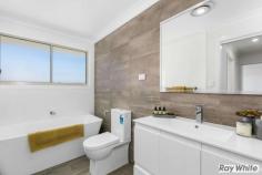 2/19-21 Mount Brown Road Dapto NSW 2530 $545,000-$595,000 It's time to be the envy of your friends. Residing in one of the most impressive developments built in the Mount Brown area, this three bedroom townhouse has a lot to offer. Beginning with the open plan living and dining area on the ground level combined with the quality kitchen with stainless appliances and stone bench-tops. You will find extra storage under the stairwell adjoining the kitchen. The living area leads out to the covered entertaining area and fenced yard ensuring your privacy. On the second level there are three bedroom's all with built in wardrobes and a generous bathroom with free standing bath and separate shower facility. Quality finishing including floor to ceiling tiles and accessories. The oversized main bedroom showcases magical views towards the beautiful Illawarra escarpment also boasts a luxurious en-suite with floor to ceiling tiles. You have an internal laundry plus separate powder room and lock up garage with internal access. Located close to schools, shops, and transport. View today and pack your bags.