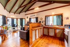 49 Blaxlands Arm Road Laguna NSW 2325 $420,000 to $440,000 – A secluded timber cottage awaits the new owner in the picturesque Wollombi Valley – Rare 5 acre lot in a natural bush land setting, set into the hill with views through the trees towards the surrounding mountains – Inside, cathedral like ceilings adorn the whole of the internal cottage creating a wonderful ambiance – The timber kitchen is open planned and looks out over the living and dining space, timber flooring throughout add to the feel of the cottage – A brand new split system A/C and combustion fireplace make this a comfortable home all year round – The two bedrooms are to one end of the cottage and are quite sizeable, with bush views – The bathroom is combined with the laundry and has a claw foot bath and corrugated iron feature walls – Opening from the living room is the large timber deck overlooking the duck pond, the perfect place to relax, enjoy a BBQ and entertain – Tank water is supplied by an approx 20,000 litre tank and a garden shed for storage complete the package – Mains power, very rare in this location! – A new lifestyle awaits, or the perfect opportunity for a weekender to escape the city life. Call to arrange your inspection today!..