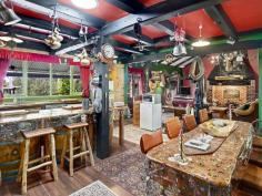 91 Denny Road Nannup WA 6275 $645,000 If you love character in a home then there is no doubt you will fall wildly in love with this one! A decade of work results in a spectacular creation from the unusual gate, the wysteria trellis, the rocky waterfall, the rusty bits of iron in the garden and timbers from both the Busselton and Bunbury jetties in the house. Sitting on a lovely 6.6 acres with Blackwood National Park to the front and the Blackwood River at the back this three bedroom, two bathroom home with its brick hearth and huge jetty beams breathes character from every pore! The mostly native gardens are easy to keep and stunningly attractive. The large back deck looks onto a waterfall with a pond at the base and views of the distant hills. Large shed, fenced orchard and vegie garden, not to mention a fox proof chook pen plus a second smaller waterfall complete the picture. Large dam at the bottom of the block supplies water for the garden and waterfalls with power in 3 places plus gorgeous riverfront views down at the bottom of the block. This has to be seen to be appreciated.