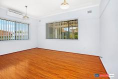 15 Proctor Avenue Kingsgrove NSW 2208 Located in a quiet street and set on approximately 505sqm, this four bedroom family home is a great opportunity for the first home buyer, family or downsizer looking to move into the area. Close to local parks, bus transport and shops, this property offers a large backyard with an undercover pergola, shed and a bbq area, great for entertaining, a neat kitchen with gas cooking, separate dining and living areas, four generous bedrooms, a bathroom offering a separate bath and shower, an internal laundry and a single car lock up garage with drive through access to the backyard. With the added bonus' of floating floorboards, a split system AC, and a toilet room.