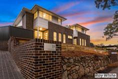2/19-21 Mount Brown Road Dapto NSW 2530 $545,000-$595,000 It's time to be the envy of your friends. Residing in one of the most impressive developments built in the Mount Brown area, this three bedroom townhouse has a lot to offer. Beginning with the open plan living and dining area on the ground level combined with the quality kitchen with stainless appliances and stone bench-tops. You will find extra storage under the stairwell adjoining the kitchen. The living area leads out to the covered entertaining area and fenced yard ensuring your privacy. On the second level there are three bedroom's all with built in wardrobes and a generous bathroom with free standing bath and separate shower facility. Quality finishing including floor to ceiling tiles and accessories. The oversized main bedroom showcases magical views towards the beautiful Illawarra escarpment also boasts a luxurious en-suite with floor to ceiling tiles. You have an internal laundry plus separate powder room and lock up garage with internal access. Located close to schools, shops, and transport. View today and pack your bags.