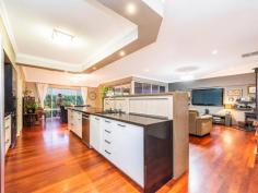 62 BODDINGTON CIRCUIT Dianella WA 6059 $849,900 You can save time and money by owning this home that ticks all the boxes for you & your family! Only three houses up the street from St Andrews Grammar private school catering from K to year 12. So you can walk them to & from school until they want to walk by themselves. We personally recommend this school as both our daughter & son went to school here and both have grown up to be well respected individuals on their way as successful as young adults. And after your children have grown up, this home is set up for a lock up and leave lifestyle for the rest of your life, so this is perfect as your “forever home”. Everyone gets their space. You can retreat up front with your own living/ theatre room, king-sized master bedroom with walk through his and her robes into the ensuite with 2 bowl vanity unit, shower and wc. A wing off to the rear side of the home has a wide passage with three double linen cupboards between it and the adjoining living areas with three good sized bedrooms, all with built in robes serviced by bathroom, wc and the laundry. This means your children are able to sleep easy and all can retreat to their own space. Greeting your guests is an impressive entrance hall which has recessed ceiling and recessed wall space for your artwork. Polished hardwood floors flow through French doors into the sweepingly big open planned casual living space, where the impressive Masters kitchen newly incorporates Schweigen exhaust Range hood direct to outside, stainless steel dishwasher, induction cook top, double oven and microwave, Caesar Stone bench tops with waterfall ends and privacy counter, appliance, pantry and with a ceiling bulkhead over, you will love cooking and serving from here and you can be a part of the goings on from here. The polished hard wood floors spread out through this area and into the dining and family rooms where a wall of windows and doors opens out to the massive outdoor alfresco where nearly the entire backyard has been paved, connecting the rear corner under cover bar area and custom built artistically created metal pergola and back-lit hedging, panels and water features. Love entertaining all year round? There is so much combined space inside and outside which will cater for just private barbecues or big parties where all your family and friends can get together for all ages. If you love sports, then call the team over to take in 2020 cricket and football. Stack the eskies and there’s TV points inside and outside so you won’t miss anything. This home is easy care and has every conceivable built in modern convenience, with ducted air conditioning, polished hardwood floors through most living areas, ceiling fans throughout and solar panels. There is nothing to do but move your family and belongings in and you will be proud to come home to this wonderful St Andrews Estate state lifestyle!. So convenient, with walking distance to local parks, playgrounds, bus route to the city, freeway access around the corner north and south east and west, a choice of many major shopping centres and schools private and public. The owners have purchased elsewhere and are ready to move so you can move straight in if you’re quick enough before the school year or close enough.