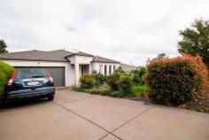 74 Ian Potter Crescent Gungahlin ACT 2912 $709,000 This is your chance to snap up a bargain! Available for the right buyer is this uncut diamond located in the heart of Gungahlin. With tenants vacating April, this home is in need of some attention requiring a deep clean and new carpets. With excellent bones and design this property has 5 bedrooms, or 4 bedrooms and a large study. The master bedroom comes with ensuite and walk-in robe and all other bedrooms except one have built-in robes. It has views from the elevated undercover entertaining area where you can enjoy a meal with family and friends. There is ducted gas heating throughout the property and gas cooktops. There is a double garage with additional driveway parking, and the rear yard is fitted with easy-care artificial turf and a productive peach tree. Ian Potter is very conveniently located just a short stroll or drive to the Gungahlin centre.. With only a few touch-ups from the new owner this property is sure to shine. We are priced to sell and this will not be on the market long so add it to your inspection schedule. Features - 5 spacious bedrooms, or 4 bedrooms plus office - Master bedroom with ensuite and walk-in robe - Built-in robes to 3 bedrooms - Gas cooktops - Two living areas - Ducted gas heating - Double garage - Easy care yards with artificial turf - Block size 459m2 - Internal living 186m2 (estimated) - EER 3.5…