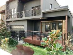 2/9 Margaroola Ave BIGGERA WATERS QLD 4216 $768,000 3 Bedrooms, 2.5 Bathrooms, DLUG Sprawling open plan Villa built in 2017 with an innovative & efficient design Solid well built construction with additional features Including- 2.4 Metre Rosewood Timber Bi Fold Doors, Rosewood timber servery window, 2.7 Metre ceilings, Retractable fly screens, Stylish, large ensuites, Multiple outdoor living options, Extremely cool home with natural North/South airflow, Expansive Street frontage, Established gardens with fully reticulated watering system, 3x Split System air-conditioners, Internal cavity sliding doors throughout, Highland Gas cooktop, Pyrolytic Smeg Oven, Bosch Dishwasher, Floor to ceiling tiles in the bathroom, External Marine Grade Plywood & wiring on Balconies. Finally, this location has to be lived to be appreciated. It is a quiet coastal enclave surrounded by waterways, Parks,Cafes, Restaurants, Shops & Transport close at hand..