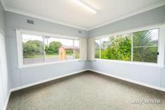 385 Dobie Street Grafton NSW 2460 Holding a highly desirable Westlawn location on approximately 600.7 square metres of level, flood-free land is 385 Dobie Street, Grafton. This property's convenient location puts you in close proximity to primary schools, the hospital, sporting facilities and the racecourse, while being just a short drive to Grafton CBD. Internally, this low-set brick and tile home offers three spacious bedrooms with carpet and blinds, a large lounge room with air conditioning and a second sitting room, study or playroom. The kitchen and dining area offer a practical kitchen and dedicated dining space. The main bathroom offers a bath, toilet and vanity with storage, while the laundry includes a shower and second toilet, also with plenty of storage. The house has been recently coated with a new paint, making it modern and fresh. The yard is low maintenance, fully fenced and offers easy living with a single lock up garage to the side. With a rental appraisal of $350 per week, this great home is perfect for investors, first home buyers and downsizers in our current market. Don't miss this great opportunity by contacting a Ray White agent today. FEATURES: • Built-In Wardrobes • Close To Schools • Close To Shops • Close To Transport • Garden;Air Conditioning…