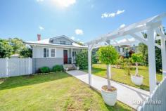 151 Alice Street Grafton NSW 2460 Alice Street is a highly sought-after area of Grafton, known for its naturally elevated position, peaceful streets and character filled homes. Here on Alice Street sits this stunning, low-set, fully renovated home boasting beautiful kerbside appeal and high-end features throughout. Nothing has been missed in this extensive renovation; the hard work put in has been well worth it as falling in love with every aspect of this home is inevitable. A white picket fence surrounding the property, gorgeous established gardens and the many period features throughout the home instantly set it apart from the others. Upon entry you walk straight into the open plan living, dining & kitchen area; offering combustion wood heating, reverse cycle air conditioning and ceiling fans. The kitchen, located toward the back of the home has been fitted with white shaker cabinets, stone benchtops, a stunning tiled splashback and a new farmhouse sink. This area showcases polished hardwood floors, ceiling roses, picture rails and period coloured glass windows. The master suite offers a spacious bedroom with built in robes, French doors to the front verandah, an ensuite with a double shower and gorgeous feature tiles. The main bathroom has the same feature tiles as the ensuite with a bath and shower. The home office is situated at the rear of the home and is separate to the house, accessed from the rear verandah providing the perfect option to work from home. As well as the rear verandah, outside offers a garden shed, an air conditioned double lock-up garage with a shower and toilet and side vehicle access to the yard. Even with all of these features, there is still plenty of room for the kids to play. To arrange your private inspection, do not hesitate to contact a Ray White agent today. FEATURES: • Built-In Wardrobes • Close To Schools • Close To Shops • Close To Transport • Fireplace(S);Air Conditioning…