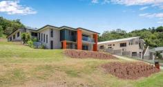 20 Eyre Pl Erakala QLD 4740 $1,100,000 This exquisite property built in 2014, satisfies the wishes of the most discerning buyers with a stunning floorplan that boasts 382sqm of underroof perfection. The house is efficiently located on a 2000sqm block with so much room available for additional shed (12mx8m plans available on request), driveways, tennis courts, or anything your imagination desires. Two driveway crossovers are at your disposal with the elevation of the block providing stunning views, constant breezes & the opportunity for striking tiered presentation. Many builders were consulted to design the home adopting the natural slope of the land & the final result is exceptional, allowing the inground pool & surrounding entertaining area to be integrated into the second level of the home, providing stunning views from all bedrooms that overlook. Leading from the double remote panel lift garage door via cascading polished timber stairs, the second level of the home immediately introduces the open plan kitchen, lounge & dining rooms that flow seamlessly via stacker screens to the outdoor entertaining area & pool. The formal lounge room has vistas as far as the Pioneer Valley & mountain lines thanks to the elevation provided at the very back of Settler's Rise Estate. The dining room is overlooked by the Caesar stone-top island bench, complete with breakfast bench, DeLonghi appliances, induction cooktop, double sink, integrated wine & beer fridges & a Butler's Pantry that the most established of chefs would die for! In fact, the Butler's Pantry possesses the best views of the home with the glassed louvres acting as a beautiful outlook, complete with space for appliances, fridges & ample storage. Leading from the kitchen, take a few steps up to the formal lounge which continues the open plan theme with stylish cut-outs that define the space & is adjacent to the handy double-desked office nook that also leads to outside. Leading from the hall, are 3 generously sized, built-in, air conditioned, carpeted bedrooms, plus a 3rd living area or devoted media room that is fully enclosed offering cozy privacy & seclusion. The bathroom & laundry has been thoughtfully designed, allowing wet feet from the pool entry via the tiled laundry & immediately into the luxuriously appointed bathroom. A separate toilet with powder room also caters for guests. At the end of the hall, a stunning introduction to the Master Suite is the glassed entry overlooking a lush fernery where the outside gardens are almost invited inside, adding to the extravagance that is afforded firstly in the Parent's Sitting Room with TV connection, then the enormous open plan ensuite & finally the king sized bedroom & massive walk in robe that acts as a separate dressing room. The Parent's Wing absorbs the furthest end of the property, has its own private deck overlooking the pool & provides all the privacy required to escape the world! Downstairs provides double car accommodation plus a generously sized storage room that has been reinforced with core filled walls to act as a cyclone shelter, providing families with even further peace-of-mind that the attention to detail adopted in the creation of this property is second to none! The 2000sqm block is enormous & due to the forethought when designing, the house has been nestled into the back right corner, allowing new owners the freedom to develop the remainder of the block in whichever way they choose, stamping it with their own style & vision!