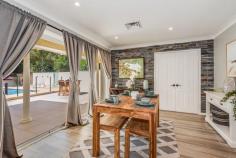 38 Chamberlain Road Wyoming NSW 2250 Sitting on just over 1 acre of parklike grounds with perfect north-east aspect and overlooking a freshwater creek meandering through shaded landscaped grounds, is this superbly renovated large 3-bedroom, single level home. The sophistication and high quality of the renovations reflects the owners’ North American inspired design, decorative skills and fine tastes. The property offers separate front and rear gated entrances, a double garage and expansive private enclosed courtyard and pool complex. Facing north is an enormous covered terrace perfect for outdoor entertaining. There is an additional backyard area with established fruit trees and raised garden beds. The immediate impression upon stepping into the house is of a grand open plan living space featuring beautiful tiled flooring throughout, a superbly arranged and incredibly functional kitchen with an oversized island and stone waterfall countertops. The bedrooms are substantially oversized with walk-in closets and are presented to the highest of standards. Both the main and ensuite bathrooms are fully renovated and reflect unique design cues from the US. There is an additional half bathroom for the pool area along with an outdoor hot and cold shower. – Stunning level small acreage on meandering stream – Unique floor and wall tiling throughout compliment the high level of restoration – New kitchen appliances – Zoned, Ducted reverse air conditioning – Large, North facing covered entertaining terrace – In-ground saltwater concrete pool – Rainwater tanks – Minutes from shops and Gosford train station – Potential for further development due to land size and dual-access, STCA…