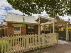 24 Clark Street Wayville SA 5034 This beautifully presented single fronted cottage retains many of its original character features including delightful pressed metal ceilings and rich polished timber floors as well as offering scope to further develop the home to suit the new owners individual style. Perfectly positioned within the city fringe, 24 Clark Street is located within an easy stroll of tram and bus transport links as well all of the cafes, restaurants, pubs and other lifestyle amenities offered by both King William Road and Goodwood Road making it the ideal location from which to enjoy the best of the cosmopolitan Adelaide lifestyle. The entrance and lounge provide a wonderful introduction to the home with the pressed metal ceilings, timber floors, picture rails and gas fireplace combining into a beautiful mix of character that sets a perfect tone for the rest of the home. The character features continue through the original part of the property with accommodation provided by a spacious master bedroom complete with built-in wardrobes and a good size second bedroom also with built-in wardrobes. A formal dining room complete with fireplace is the perfect bookend to the original front section of the house and provides a wonderfully cosy entertaining space. The modern kitchen and second living space overlook the private low maintenance rear garden through the lovely bay window and the space opens out through the glass sliding door to the covered outdoor entertaining area beyond. The sizeable bathroom offers the convenience of separate bath and shower as well as a completely independent toilet. A separate laundry, large pantry, covered service pergola, single carport, solar power and air conditioning complete this wonderful home. Key features include:- • Character filled entrance and formal lounge • Spacious master bedroom with built-in wardrobes • Good sized second bedroom • Formal dining room • Large bathroom with separate bath and shower • Modern kitchen with gas cooking and dishwasher • Separate laundry • Covered outdoor entertaining space • Private low maintenance rear garden • Single carport • Plantation shutters • Air conditioning • Solar panels Specifications:- CT / Volume 5356 Folio 996 Council / City of Unley Zoning / Residential Streetscape (Built Form) Policy Area 9 Built / 1920 Internal / 140 m2 (approx.) Land / 312 m2 (approx.) Council Rates / $1352 pa (approx.) SA Water / $204.46 pq (approx.) (supply & Sewerage) ES Levy / $140.25 pa (approx.)