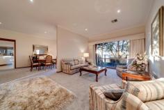 5/95 Crisp Circuit Bruce ACT 2617 Peacefully positioned in an exclusive dress-circle location backing Gossan Hill Nature Reserve and capturing magnificent panoramic views across the Belconnen Valley, Lake Ginninderra and Brindabella Mountain Ranges is this impeccably presented four bedroom family residence. Located within Bruce's most prestigious boutique complex the "Somers" is this inspirational freestanding, split level townhouse that sprawls across an expansive north-west facing block. The development was privately built by award winning builders the Rosin Bros, and with no expense spared the home showcases quality craftsmanship. The current owner has resided in this impressive home for nearly 30 years, and during this time has enjoyed its unique design, enviable location and has proudly maintained the home and grounds to the highest of standards. This architecturally designed retreat is brilliant for busy professionals or as a wonderful family home, particularly for those who love to entertain. Located on the entrance level are four spacious bedrooms, main bathroom including a luxuriously proportioned, and segregated master which boasts magnificent garden views, a bank of wardrobes along one side of the room and sparkling ensuite with spa bath and dual sinks. The fourth bedroom has been brilliantly set up as a study/home office with its quality custom built workstation. The split level design offers formal living and dining rooms which flow through to an open plan family room, meals area and impressive gourmet kitchen - the chef of the home will love the sublime cooking space. Bathed in natural light and with captivating views is the sunroom extension which is the ideal setting for year round family get-togethers or a peaceful setting where you can relax and unwind while reading the Sunday paper. The established gardens are magnificent with the Japanese influenced design displaying colours that compliment Canberra's four seasons. The gardens are designed to provide shade in the summer months, keeping the home to a cool temperature. Special features include: * tranquil and elevated position backing Gossan Hill Nature Reserve * tightly held boutique complex of seven owner occupied homes * magnificent views * freestanding split level, four bedroom townhouse * welcoming front entrance overlooking an atrium * formal open plan dining and living room with 2.7m ceilings and slow combustion fireplace * master bedroom with custom designed wardrobes * ensuite with floor to ceiling tiles, spa bath, separate shower and dual sinks * four segregated living areas * north facing sunroom extension with Sydney Blue Gum flooring, RC/AC, luxaflex blinds to all windows and external access to the timber deck and gardens * gourmet kitchen with 20mm Caesarstone bench tops, glass splashback, soft closing drawers, * Miele stainless steel pyroletic oven, induction ceramic cooktop, microwave/convection oven, dishwasher, walk in pantry, and generous storage with custom built cabinetry * open plan meals and family room with LED lighting * ducted gas heating and ducted air conditioning throughout * bedrooms two, and three are generous in size; both with built in robes * bedroom four/study - featuring quality built-in cabinetry * sparkling main bathroom plus separate toilet and powder room * as new carpet * security flyscreens to some rooms * private north facing timber deck * spacious laundry with ample storage * abundant storage throughout * spacious brick double garage with auto door * garage roof storage with loft ladder access * new steel gutter guards * 2,500 ltr water tank with pump * instant gas hot water * eight solar panels - fed back to the grid * alarm system * magnificent gardens with irrigation and rock retaining walls Living - 261.90sqm Garage - 46.40sqm Total - 308.30sqm B/C fees - $5,163.12 pa Rates - $3,164.35 pa With the top end of Bruce one of Canberra's most unique and sought after communities, you will fall in love with the unbeatable location with the rear boundary accessing hectares of natural bushland. The location is outstanding providing an easy walk through reserve to the University of Canberra and Radford College for students. On your doorstep is the AIS, three major hospitals, with the ANU and City Centre only 6 minutes away. Westfield Belconnen and the popular Jamison Plaza are close by for your convenience. ** PLEASE NOTE this property will go to auction on Thursday, 18th June at 6:00pm. To register and watch the live stream please go to www.raywhitecanberra.com.au/watch-our-auctions-live. Please call Phyllis directly to discuss further. ** FEATURES: • Air Conditioning • Built-In Wardrobes • Close To Schools • Close To Shops • Close To Transport • Fireplace(S)..
