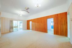 11 Birdwood Street North Ipswich QLD 4305 $299,000+ This home has been meticulously maintained, featuring high ceilings, plenty of living area, a huge amount of storage space and stunning gardens. Whether you are a first home buyer, renovator or investor - this property is truly something special; don't miss out, book your inspection today! - Massive main lounge room; air-conditioned with ceiling fan, carpet and extra-high ceilings - Huge kitchen with high ceilings and an enormous amount of preparation and storage space; ceiling fan, vinyl flooring and electric oven, large enough to serve as an eat-in kitchen if desired - Spacious formal dining/secondary living area; carpeted with raked ceiling - 3 bedrooms, 2 with ceiling fans, extra-high ceilings and additional dressing room/office spaces adjacent - Bathroom is neat and tidy and features a combined bath/shower with sliding glass screen; separate toilet - Front entry provides an additional living/office/play space; carpeted - Underneath the home is a vast concreted and enclosed storage/rumpus space with multiple sections; extremely neat and tidy with good lighting and ventilation, laundry located within the main area - Extra-wide double lockup garage with direct internal access both upstairs and downstairs - Built-in BBQ area adjacent to fully concreted driveway - Gorgeous landscaped gardens throughout the property; well established and maintained - 2 well-sized garden sheds plus greenhouse/aviary - Fully fenced property - Security screens throughout Area Details: • Walking distance to public transport access • 2 minutes* to Ipswich North State School • 2 minutes* to St. Josephs Primary School • 4 minutes* to Riverlink Shopping Centre and Ipswich CBD • 6 minutes* to Ipswich Hospital • 8 minutes* to USQ Ipswich Campus • Easy highway access for commuters..