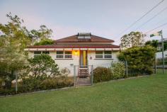 11 Birdwood Street North Ipswich QLD 4305 $299,000+ This home has been meticulously maintained, featuring high ceilings, plenty of living area, a huge amount of storage space and stunning gardens. Whether you are a first home buyer, renovator or investor - this property is truly something special; don't miss out, book your inspection today! - Massive main lounge room; air-conditioned with ceiling fan, carpet and extra-high ceilings - Huge kitchen with high ceilings and an enormous amount of preparation and storage space; ceiling fan, vinyl flooring and electric oven, large enough to serve as an eat-in kitchen if desired - Spacious formal dining/secondary living area; carpeted with raked ceiling - 3 bedrooms, 2 with ceiling fans, extra-high ceilings and additional dressing room/office spaces adjacent - Bathroom is neat and tidy and features a combined bath/shower with sliding glass screen; separate toilet - Front entry provides an additional living/office/play space; carpeted - Underneath the home is a vast concreted and enclosed storage/rumpus space with multiple sections; extremely neat and tidy with good lighting and ventilation, laundry located within the main area - Extra-wide double lockup garage with direct internal access both upstairs and downstairs - Built-in BBQ area adjacent to fully concreted driveway - Gorgeous landscaped gardens throughout the property; well established and maintained - 2 well-sized garden sheds plus greenhouse/aviary - Fully fenced property - Security screens throughout Area Details: • Walking distance to public transport access • 2 minutes* to Ipswich North State School • 2 minutes* to St. Josephs Primary School • 4 minutes* to Riverlink Shopping Centre and Ipswich CBD • 6 minutes* to Ipswich Hospital • 8 minutes* to USQ Ipswich Campus • Easy highway access for commuters..