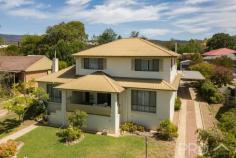 97 Russell Street Tumut NSW 2720 $489,000 Centrally located and set upon an extremely generous Easterly facing 2,023m2 allotment, you will love the versatility on offer of this oversized family home that is conveniently set out over two levels. Boasting multiple bedrooms, bathrooms and living areas positioned on both levels, with formal internal and external entertaining areas and sprawling easterly views. You will love calling 97 Russell street your home. Do not miss your opportunity, call today to book an inspection! Premiere Features: - Five great sized bedrooms all with built in robes, oversized king master suite located on the upper level with great views - Main bathroom downstairs with combined shower/bath, toilet and single vanity - Ensuite to main located upstairs with dual entry to service additional bedrooms upstairs, comprising of separate bath, shower and oversized single vanity with great storage options - Third shower and toilet located separately off the rear of the laundry - Centrally located kitchen with great storage options, large island bench and electric appliances - Formal dining area with direct front deck access - Open plan living with additional dining area, gas heating and also boasting rear entertaining access - Front fully covered deck overlooking the sprawling hills to the East - Rear fully covered outdoor entertaining area - Sun room positioned to the rear of the plan with large study nook, very easily converted to a third lounge - Great sized laundry with external access - Side vehicle access - Carport to the side of the property and a second midway through the large block - Tandem lock up single bay shed with power - Woodbox fire heater - Ducted air conditioning and gas and electric heating options - Additional wood shed - 2,023m2 slightly forward sloping allotment - Sprawling views from the eastern side of the home..