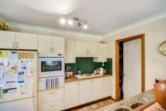 13 Betula Grove Bundanoon NSW 2578 $640,000 DUE TO COVID-19 RESTRICTIONS ALL INSPECTIONS ARE BY APPOINTMENT ONLY Fabulous home with a pretty facade, perfect for first home buyers, retirees or those looking to downsize and become part of the charming village of Bundanoon. Living areas are both very generous and offer a quiet more formal space compared with the large sun filled open plan family room, dining and galley kitchen. Positioned to capture northern sunshine with large windows allowing loads of natural light Centrally located kitchen with huge walk in pantry Casual living space flows to the covered deck overlooking the rear yard Welcoming entry hall with cloak cupboard along with extensive storage throughout All 3 bedroooms have built in robes and are generous in size, the master having its own ensuite The remaining 2 bedrooms are serviced by a modern and conveniently located 3 way bathroom There is a 3rd WC in the laundry which doubles as a mud room due to its sheer size Garaging is via a single garage with off street parking available. The rear yard is privately hedged and fenced with easy care lawn areas front and rear. Surrounded by quality properties in a quiet cul-de-sac ensuring both privacy and a peaceful lifestyle or retirement….
