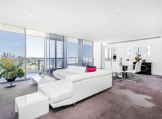 1801/30 The Circus Burswood WA 6100 This stunning Mirvac built penthouse has panoramic views on every side, taking in city skyline, Swan River, Optus Stadium, Matagarup Bridge Crown Towers & The Darling Ranges. The home sits over two levels of quality finished & spacious rooms. The floor plan provides ample space for a family, with multiple living areas for privacy & comfortable living. One of 3 penthouses, high up on the 18th floor of the Axis building in The Peninsula Burswood estate. This 4 bedroom, 4 bathroom skyhome features a huge rooftop terrace for entertaining where you can take in the sensational city views and our remarkable WA sunsets. This is also the perfect place to watch the sky shows in the City, Burswood and Stadium throughout the year. Residents of The Peninsula Burswood are spoilt for choice for dining and entertainment options. Its a short stroll along the promenade to Crown and the Stadium with all they have to offer. The 3B’s (Burwood Bar & Bistro) is on the ground level of the building with cafe’s just next door. FEATURES: • 4 Big bedrooms, 2 with ensuites • Miele integrated appliances • Unparalleled views • Multiple living spaces • Separate study • Rooftop entertaining terrace • Resort style facilities including pool, gym & BBQs..