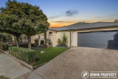 18 John Winter Street Gungahlin ACT 2912 $769,000 This single level, spacious and contemporary family home set in an ideal location offers a long list of features which will ensure that it is a must-see list for many home buyers. THE HOME A pair of mature mop top trees and the double door entry offers an inviting welcome, hinting that you're inspecting something special. Immediately inside the home, a large formal living space enjoys lovely natural light, the perfect space for more formal occasions. The heart of the home consists of the kitchen and an open plan family/meals/dining room that opens onto the alfresco area and courtyard via french doors. This is a great space, big enough to host large gatherings. Many an evening during the cooler months will be spent cuddled up by the wood fire. The large kitchen is beautifully finished. It features stone bench tops with timber features, 900mm freestanding oven, generous breakfast bar, Miele dishwasher and a separate coffee bar. The master bedroom is a spacious size and features a large walk-in wardrobe and a freshly updated ensuite bathroom. There are three additional bedrooms, all well sized and featuring built-in wardrobes. The sleek main bathroom has been completely renovated with large, easy clean tiles, a free-standing bath, timber accents and a separate toilet. The double garage benefits from internal access, a power door opener and a generously sized driveway with plenty of off-street parking. Outside, there's a paved alfresco area with a water feature plus a private courtyard. The low maintenance garden also features raised veggie beds, ideal for those with a green thumb. THE LOCATION John Winter Street is a quiet street on the northern side of Gundaroo Drive. Within a short five-minute stroll is picturesque Yerrabi Pond, a lovely spot for an evening stroll, enjoying the surrounding parks and feeding the ducks. The Yerrabi waterfront also features a number of businesses including restaurants and a hair salon. Within just 1km, Gungahlin CBD offers a vast array of shopping outlets, schools, gyms, medical facilities, restaurants, cafés and a light rail station. PROPERTY FEATURES Stylish & single level 4 bedroom home in ideal location Large master suite with updated ensuite & walk-in wardrobe Sleek kitchen with stone tops, 900mm freestanding oven & coffee bar Large formal living area Open plan meals/family/dining room with fireplace Ducted gas heating, split system AC & ceiling fans Paved alfresco, courtyard & raised veggie beds Yerrabi Pond within 600m & Gungahlin CBD 1km away Living: 200.3 Garage: 39 Porch: 2.7 Total: 242 (All approx. m2) Rates: $548.50 per quarter (approx.) Please contact Jonathan Irwin for more information on 0421 040 082 or jonathan@irwinproperty.com.au.