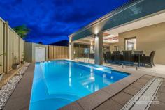 19 Tulum Approach Iluka WA 6028 Offers close 5pm 25 June 2020, the owner reserves the right to accept an offer prior to this date. Price guide in the MID 1.2mil range. Presenting the perfect blend of sophisticated design and coastal ambience. This remarkably spacious family home delivers in every aspect, including a variety of entertaining zones and open plan living that optimises natural light at every opportunity. This exquisite family home is designed to provide both sophisticated and informal retreats that facilitate contemporary coastal living. Offering an oasis of space with free flowing and relaxing modern living areas that blend effortlessly with the entertaining, dining and alfresco zones. With clever design, a functional living plan and remarkable space for the entire family, this home will exceed all of your expectations. Located in the prestigious coastal suburb of Iluka, you will discover a host of key amenities within minutes of home. Call us today for further details or plan to view this fabulous property at our next opening. Features: GROUND FLOOR • Kitchen with QStone waterfall bench-top, Blanco 900mm under bench oven, gas cook- top, Blanco range-hood, Meile dishwasher, Panasonic integrated microwave and breakfast bar • Banquet sized dining area with an alfresco outlook • Enormous central family room with feature recess ceilings & pool views • Study with built in desks, shelving and cabinetry • Home theatre with feature coffered ceilings and mood lighting • Bedrooms 2 and 3 are Queen sized with built in robes • Bedroom 4 is King sized with built in robes and Semi ensuite second bathroom • Separate powder room • Laundry with plenty of storage • Large double garage and storeroom with shoppers entrance • Mature manicured gardens with automatic reticulation • 8-metre long concrete pool with built in seating with provision for both solar and gas heating • Synthetic lawn area • Alfresco is accessed through stacked bi-fold glass doors with coffered cedar lined ceilings, ceiling fan and Jet Master fire place UPSTAIRS • Sydney Bluegum solid timber floorboards • Polished stainless steel balustrade highlight the stunning staircase • Living room with fireplace • North facing balcony with marine grade stainless steel balustrade and cedar lined ceilings • King size master suite with direct balcony access and feature ceiling • Ensuite with QStone benchtops, oval spa bath and separate toilet Additional features • LG Ducted and zoned reverse cycle air conditioning • Security alarm • Sydney Bluegum solid timber floorboards • Skirting boards and quality cornices Feature ceilings and wall recesses • 3-phase power • Data points to all bedrooms • Clay roof tiles • Built in 2012 by Trendsetter Homes • Block approx 589sqm • House approx 440sqm..