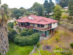 60 Garland Road Roleystone WA 6111 $599,000 Imagine sitting on the front balcony overlooking the mesmerizing misty valley views. WOW! What a great package. A very generous sized pole home built to take advantage of “those views”. Offering a flexible floor plan that could be 4 bedrooms 2 bathrooms plus study or 4 bedrooms and an additional lounge room. Either way there is plenty of room for everyone. Large open plan family / dining and games rooms all with an eye to the out doors. The kitchen is huge and boasts extensive cupboards and bench top space, breakfast bar and of course a dishwasher. The master bedroom has direct access to the wide decks so you can just pop out for a morning cuppa embracing the view across the valley. A luxury ensuite with huge spa bath completes your personal indulgence. Some of the fantastic features here include a massive under croft area which currently has a built in powered garage but could be extended to be REALLY BIG. Right now there is room for boat caravan and more ( very high too). PV solar to keep the bills down plus cheap to run heat pump HWS. Your dog will be safe too in the securely fenced garden. A great family orchard with a prolific Mandarin (the owner tells me that he got 23 shopping bags of fruit from it last year), Orange, Meyer Lemon, Cherry and Fig. It is wonderful to pick fruit from your own trees. Even more features include security alarm and both evaporative ducted air conditioning and reverse cycle air conditioning. This is a quality built and very well presented home which will have your friends wanting to stay. This is what we love about living in Roleystone. Be a part of it and secure this for your family today..