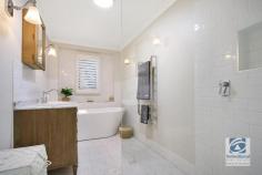 32 Isaacs Avenue Yackandandah VIC 3749 $739,000 This beautiful home's contemporary modern feel and light-filled interiors are bought to life with engineered timber flooring, plantation shutter blinds, and attention to detail throughout. Showcasing vaulted ceilings with oversized ceiling fan, the spacious living area houses a light filled study nook whilst a wood fire is the warming focus. A large split system is also installed for year-round comfort. A beautiful glass-wrapped family sunken dining area steps out onto an exterior meals area providing an exceptional space for family living and entertaining. The stunning premium kitchen is appointed to chef standards with stone benches, European appliances, central island bench, walk in pantry and a dual fuel Belling oven and stove top – even the most discerning cook will be impressed. The large master suite is a spa-like retreat waking up to tree top views with built in robes and textured carpets. A stylish ensuite sits beside a separate room, with quad built in robes, that could be utilsied as a child's nursery, dressing room or home office space. The remaining two-bedrooms are generous in size and equally well-serviced with a walk-in robe for bedroom two and built-in robes for bedroom three. A stunning main bathroom with walk-in shower and luxurious free-standing bath is nestled between these rooms. Generous appointments include double-glazed windows, solar hot water, sound proofing in ceiling, 6-star energy rating, computerized water system and so much more. Surrounded by easy-care landscaping, with plenty of room for vegetable gardens and for the kids to explore, plus only minutes to the town centre of Yackandandah, this property will delight you.