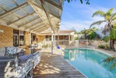 9 Albacore Drive Sorrento WA 6020 All offers presented by 6:00pm, Thursday 16th July 2020, unless sold prior. Ideal for a family that wants to live close to the beach but not too far from everything else, this elevated 5 bedroom 2 bathroom home will make for the perfect relaxing haven, once your own personal modern touches are added to it throughout. High raked ceilings and stylish light fittings grace a sunken formal lounge room off the entry, whilst the beautifully-tiled open-plan kitchen and dining area is also sunken and boasts a double storage pantry, a large fridge/freezer recess, double sinks, a dishwasher nook, a range hood, a Chef gas cooktop, Westinghouse oven, tiled splashbacks and outdoor access to the rear where a fantastic pitched patio and entertaining deck splendidly overlooks a sparkling below-ground solar-heated swimming pool with a bubbling spa and neighbouring tropical gardens. A carpeted family room can be found next to the dining space and features a corner wood fireplace and a split-system air-conditioning unit for all-seasons' comfort. Stepping up from the main living zone reveals a light, bright and spacious games room that is great for both kids and adults with its built-in bar/storage area, high ceilings, split-system air-conditioner, fan gleaming Bamboo floorboards, external poolside access and gorgeous double French doors for privacy. Also downstairs lies the main family bathroom with a separate bathtub and shower, as well as all five bedrooms - including a fifth bedroom-come-nursery next to a sublime front master suite, comprising of a walk-in wardrobe, another split-system unit, an intimate ensuite with a shower and toilet and a separate vanity/powder area for washing up. Upstairs, the large carpeted loft area can either be your study or another children's play area with roof storage access. Completing this wonderful package is a remote-controlled double lock-up garage with internal shopper's entry via the kitchen. Walk to the lovely Harman Park and Seacrest Village Shopping Centre at the bottom of the street, enjoy a leisurely stroll to nearby bus stops, the sprawling Seacrest Park Community Sporting Facility and Sacred Heart College and indulge in a very short commute to glorious Sorrento Beach, Hillarys Boat Harbour, the Sorrento Surf Lifesaving Club, coastal cafes and restaurants, more public transport, the freeway, Sorrento Primary School, Duncraig Senior High School, medical facilities and major shopping centres - Westfield Whitford City included. Sensual sea breezes await you here, there is no doubt about it! PROPERTY FEATURES; • North-facing backyard, patio and swimming-pool setting • Double-door entrance • Sunken formal lounge • Casual family room next to the kitchen/dining area • Separate elevated games room • Large upstairs study/loft area with roof access for storage • Carpeted downstairs bedrooms, including 2nd/3rd bedrooms with built-in robes • Practical tiled laundry with a storage cupboard and outdoor access • Second ground-floor toilet, separate from the main bathroom • Ample hallway linen storage • Internal shopper's entry via the double garage • Ducted-evaporative and split-system air-conditioning • Security-alarm system • Feature skirting boards • Gas hot-water system • Reticulation • 720sqm (approx.) block with two side-access gates • Built in 1987 (approx.) LOCATION FEATURES; • Walk to lush parks and the local shopping village • Close to bus stops, other shopping centres and schools - including Sorrento Primary, Sacred Heart College and Duncraig Senior High • Easy access to Sorrento Beach and Hillarys Marina • Minutes from coastal cafes and restaurants • Short commute to the freeway and other public-transport options..