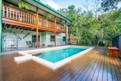 37-39 Jamieson Close Gordonvale QLD 4865 $600's Therese Plath is excited to present this fabulous property surrounded by quality homes with great neighbours in a sought after location. The setting is perfect The location is first class. A fabulous hideaway only 25kms from Cairns City Centre. Surrounded by natural bushland, this magnificent immaculately presented five bedroom home positioned in an elevated position providing a peaceful setting and privately set back from the close. This solid home is a lifestyle concept waiting for your inspection. Upstairs you will be graced with the expansive open plan design seamlessly integrating the renovated gourmet kitchen, living and dining areas. Polished timber floors and plenty of windows create a light filled and airy space for the family to unwind also including the spacious bathroom ensuring your families comfort. Flowing from here you will be greeted by ultimate privacy and tranquility where you may indulge yourself in your own little world whilst entertaining. This perfect timber alfresco area looks over the large swimming pool and tree house views of the mountains capturing all breezes. For the avid cooks they will appreciate the stunning gourmet kitchen which is ideally placed for quick meal delivery to the dining and living area and overlooks the large scale entertaining area. Recently upgraded with sleek white cabinetry, granite benches including waterfall style bench, breakfast bar, soft closing drawers, a butlers pantry and attractive appliances & fittings, including gas cook top, double wall oven and dishwasher and double fridge space gives this kitchen a modern timeless feel. On the upper level there are three bedrooms the master with ample storage space and each bedroom enjoying the privacy of the bushland surroundings. Stepping downstairs a spacious living and theatre area greets you making this ground level the ultimate entertainers haven. Doors open onto the pool area allowing a seamless transition between indoors and outdoors where you will gather with family and friends. You will love the two massive bedrooms serviced by the bathroom promising to be popular for the extended family or teenagers with easy access to the delightful pool. Other features include; • Internal laundry • Loads of storage • New carpets • Double remote car accommodation + work shop + side access for boat | trailer • Large double bay shed - easy access from street level • Several fruit trees • Chicken coupe The property's prime location of peace and privacy retains the suburban advantages of a short 5 minutes' drive to Gordonvale shopping centre, schools and sporting. Tucked away and in a class of its own Therese Plath is thrilled to offer this prized property. Therese Plath 0418 772 995 therese.plath@raywhite.com FEATURES: • Air Conditioning • Built-In Wardrobes • Close To Schools • Close To Shops • Close To Transport • Garden..