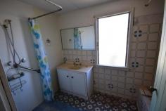 11 BROLGA STREET LONGREACH QLD 4730 $145,000 With the current layout the property has two bedrooms, impressively sized living room and an enclosed verandah on the northern and eastern sides of this home. The front verandah has a lovely view of the street and front yard, perfect place for that cuppa or after work drink. Current inclusions of original classic features including pressed metal ceilings, VJ Walls and timber floors are a rare sight to see. Improvements on the property include external cladding, replacement of roof, evaporative a/c throughout with the addition of a split system on the verandah. You will also find an open and airy kitchen and separate dining area. The large bathroom with both shower tray and good size bath will easily provide the space needed for a growing family. Out the back you will find a Double bay shed situated on a large block with plenty of space for whatever your heart's desire, gardens, green house, dog pens, space for it all. This home is looking for a keen renovator to bring it up to date and highlight the much sought after classic features found within. Rare opportunity in the Longreach Property market! Contact Matthew Strong on 4658 1122 or 0428 509 449 to arrange an inspection.
