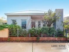 63 Barrington Avenue Champion Lakes WA 6111 $378,000 This floor plan could be all configurations (subject to approval), or you can have the extra living. Anyway you want, its a really good size. Lets talk location first. Just 70m to the waters edge Well , what a lifestyle. Imagine magnificent walking paths around the beautiful waterways of this international rowing venue, just at you doorstep or maybe you would prefer to get the kayak out. Maybe even the bike. (forget the Gym). Enjoy fantastic public open space and BBQ areas to meet up with friends and neighbors. Surrounded by top class homes and like minded people all the homes in this area are built to a high standard ensuring the security of your investment. This home is a perfect down sizer for those who don’t want to be a slave to the garden but still have some space. With all the internal finishing done to a high standard including beautiful tiles to living areas, reverse cycle air conditioning and tasteful decor throughout. Just move in here and get on with the relaxing. The floor plan is very flexible but as it is currently set up, you have a nice sized master with big robe and ensuite plus a second bedroom and adjacent second bathroom as well. The current dining can easily be the 3rd bedroom, plus you have a theatre room at the front (could be 4th bedroom). The main living is next to the well appointed kitchen boasting the all important dishwasher. This includes dinning and family rooms leading straight out to terrific private alfresco area. This area also joins the double garage which has its access from the rear lane way. Note. There is room here for a small caravan or trailer too via an rear extra gate. The garden is just beautiful and so relaxing. It is cool and private and the back alfresco is extra large just perfect for Summer. ( Not far away now ). This home is extremely well priced. Just look at the other homes in the area then call me for you private viewing. Features • Air Conditioning • Built In Robes • Dishwasher • First Home Buyer • Gas Hot Water Service..