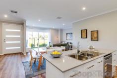7 Tidsworth Lane Lightsview SA 5085 Perfectly positioned this ultra-urban community of sustainable, innovative, and sleek executive style living with all the required elements of a desirable estate. Set over two spacious levels this beautifully presented home overlooks lush parklands, tennis courts and a playground with the lake at the end of a Private Lane. Relish the opportunity for a ‘turn key’ lifestyle in this sought after suburb only moments to Northgate Shopping Village and 8 short kilometers from Adelaide’s CBD. Lightsview is a vision of community, lifestyle with a social and environmental conscience this home is no exception and offers a fantastic opportunity for buyers and investors alike. Featuring an open plan design to the lower level of living, kitchen and dining room taking advantage of gorgeous vistas over the park and opening out through sliding glass doors to the front gardens. The stunning parklands make for the perfect place to kick a football or engage in some cricket with the neighbors- arguable the most enviable backyard in Adelaide! The kitchen is sure to impress the home cook or entertainer with a plethora of features including island bench, spacious walk in pantry, quality stainless steel 900w cooker and clear glass splashback with views to the central entertainer’s courtyard. Spacious accommodation to the upper level includes three generous bedrooms perfect for family or guests with all rooms complete with built in robe storage and the stunning Master Suite with ‘his’ and ‘her’ robe and luxe ensuite with double vanity. Completing the upper level is a second living area, study nook and main bathroom with bath. Added Features to love; • Lower level Powder room plus additional powder room to the upper level • Floating Timber floorboards to the lower level living areas • Multi zoned ducted reverse cycle air-conditioning throughout • Double lock up garage with direct access to the internals • Ample storage throughout • Quality schooling including Cedar College, St Martins and Roma Mitchell Secondary School • Only minutes to Northgate Shopping Centre and Greenacres Shopping Centre • Easy access to public transport including the Klemzig Interchange..