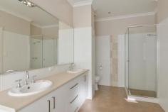 14B Purna Place Hannans WA 6430 $509,000 Welcome to your new home at 14B Purna Place. Tucked away in the cul-de-sac, there is no through traffic here and what a peaceful and private place to call your own. From the front you can see the property has used the 709sqm block to its full potential, leaving you with a great sized yard for the kids & pets alike, without skipping on size anywhere else. This two storey, brick & iron family home is more than meets the eye – just wait until you come inside! – From the entrance you will be greeted with beautiful tiled flooring and access to the garage from a separate door – you will notice the staircase to the right of the entrance hall – we will get to that in a moment… – Take a walk down the hallway – which is both bright & airy – then turn left, you will be taken to the main bedroom through double doors, what a grand feeling. The master bedroom is large in size and has the extras to make it luxurious including soft carpet, his and hers built in robes and an en-suite larger than the ordinary, including double vanity & huge mirror! – Coming back out from the master bedroom into the hall, you will walk into a large open plan kitchen/dining/living area – which is made to feel even larger with the tall ceilings & fancy cornicing – this is a great place for the family to come together after a busy day – The kitchen includes 900mm oven & stove top as well as stainless steel range hood & storage galore! The island bench is a great place for a relaxed breakfast in the morning before the day starts. – From the living area you walk through a second hallway to the second bathroom, laundry and remaining bedrooms which are all great sized and feature built-in-robes, soft carpet & blinds. – The family bathroom is close by the minor bedrooms and features a large bath, separate shower and vanity, there’s room in here to move. – Back to the front of the home and that staircase that you’ve been waiting for – The Views up here have been kept in mind when designing this home – you should come and look for yourself! Up here is a carpeted second living area with windows to take advantage of the scenery overlooking Karlkurla bushlands. The sunsets are amazing here. From this second living area is also an office or storage room, but it gets better than that. – The upstairs is set up to easily be used as a 5th bedroom and that office/storage room is already plumbed for a 3rd bathroom, so not only do you have options here but the hard work has been done, all you need to decide is what you want to use it for! – The whole home is serviced by refrigerated air conditioning, perfect for Kalgoorlie Summers when its just too hot to do anything else! – Heading outside you will be surprised at the size of the gabled entertaining patio, this is a great place for entertaining while still leaving a large grassed area for the kids to play which is easily maintained by the auto retic, don’t forget the good sized garden shed to hide away the gardening tools! This home is definitely worth a viewing to appreciate what we have here – to make an appointment to view contact Denise 0414 280 442 – you wont be disappointed. Rates: $2,703.24pa Water Rates: $240pa Zoning: R20 Block Size: 709sqm..