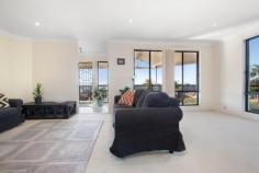 57 Delaware Drive Macquarie Hills NSW 2285 $575,000 Elevated up from the street to enjoy a bright north-easterly aspect and the most amazing views and sunsets, this warm and inviting residence offers a flowing single level floorplan with a choice of two separate living areas and outdoor flow to a wide wrap-around deck for alfresco entertaining. Delivering a real sense of peace and privacy, this is a spacious, comfortable and low maintenance home for a growing family, or readymade investment with a long-term tenant keen to stay. Step inside to a practical floorplan featuring a bright and spacious lounge room and a relaxed open plan family living and dining space anchored by a granite-topped kitchen and access to the fenced backyard where kids and pets can play with a sense of freedom. At the front of the home, far-reaching views stretch out in front of you from the deck where there's plenty of space for a dining setting and barbecue. Sleeping quarters are perfectly zoned with the master bedroom and ensuite separated from the three kids' bedrooms and the family bathroom. A freestanding double garage as well as ample driveway parking complete this appealing home. Family-friendly Macquarie Hills is quietly located on the fringe of Lake Macquarie's cafes, shopping and leisure activities with Cardiff CBD, public transport and a choice of schools nearby. * Warm and inviting brick and tile home on northeast facing 618sqm elevated parcel - Air-conditioning and gas heating to lounge and family room - A neutral palette complements a mix of tiles and carpet underfoot - Wide wrap-around deck at front of home and fenced landscaped garden at rear - Kitchen with granite benches, gas cooktop and dishwasher - Bathroom with Caesarstone vanity, bathtub, shower and separate w/c - 3 kids' bedrooms all with built-in robes share a family bathroom with separate w/c - Double freestanding garage with one automatic door - Less than 10 minutes drive to Lake Macquarie and 20 minutes to Newcastle CBD - Available with vacant possession or with happy long term tenant Disclaimer: All information contained herein is gathered from sources we deem reliable. However, we cannot guarantee its accuracy and act as a messenger only in passing on the details. Interested parties should rely on their own enquiries. Some of our properties are marketed from time to time without price guide at the vendors request. This website may have filtered the property into a price bracket for website functionality purposes. Any personal information given to us during the course of the campaign will be kept on our database for follow up and to market other services and opportunities unless instructed in writing.