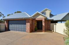 14B Purna Place Hannans WA 6430 $509,000 Welcome to your new home at 14B Purna Place. Tucked away in the cul-de-sac, there is no through traffic here and what a peaceful and private place to call your own. From the front you can see the property has used the 709sqm block to its full potential, leaving you with a great sized yard for the kids & pets alike, without skipping on size anywhere else. This two storey, brick & iron family home is more than meets the eye – just wait until you come inside! – From the entrance you will be greeted with beautiful tiled flooring and access to the garage from a separate door – you will notice the staircase to the right of the entrance hall – we will get to that in a moment… – Take a walk down the hallway – which is both bright & airy – then turn left, you will be taken to the main bedroom through double doors, what a grand feeling. The master bedroom is large in size and has the extras to make it luxurious including soft carpet, his and hers built in robes and an en-suite larger than the ordinary, including double vanity & huge mirror! – Coming back out from the master bedroom into the hall, you will walk into a large open plan kitchen/dining/living area – which is made to feel even larger with the tall ceilings & fancy cornicing – this is a great place for the family to come together after a busy day – The kitchen includes 900mm oven & stove top as well as stainless steel range hood & storage galore! The island bench is a great place for a relaxed breakfast in the morning before the day starts. – From the living area you walk through a second hallway to the second bathroom, laundry and remaining bedrooms which are all great sized and feature built-in-robes, soft carpet & blinds. – The family bathroom is close by the minor bedrooms and features a large bath, separate shower and vanity, there’s room in here to move. – Back to the front of the home and that staircase that you’ve been waiting for – The Views up here have been kept in mind when designing this home – you should come and look for yourself! Up here is a carpeted second living area with windows to take advantage of the scenery overlooking Karlkurla bushlands. The sunsets are amazing here. From this second living area is also an office or storage room, but it gets better than that. – The upstairs is set up to easily be used as a 5th bedroom and that office/storage room is already plumbed for a 3rd bathroom, so not only do you have options here but the hard work has been done, all you need to decide is what you want to use it for! – The whole home is serviced by refrigerated air conditioning, perfect for Kalgoorlie Summers when its just too hot to do anything else! – Heading outside you will be surprised at the size of the gabled entertaining patio, this is a great place for entertaining while still leaving a large grassed area for the kids to play which is easily maintained by the auto retic, don’t forget the good sized garden shed to hide away the gardening tools! This home is definitely worth a viewing to appreciate what we have here – to make an appointment to view contact Denise 0414 280 442 – you wont be disappointed. Rates: $2,703.24pa Water Rates: $240pa Zoning: R20 Block Size: 709sqm..