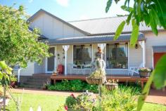 13 Scarlet Gum Street Ulladulla NSW 2539 $629,000 This country style family home exudes both warmth and charm. Dado walls help frame each living room while the crackling fireplace entices you to settling in for the rest of the day. Situated on a corner block and surrounded by a white picket fence and mature gardens you really get a sense of peace when you walk into this property. * four large bedrooms all with built-in robes *master bedroom with ensuite *main bathroom with soaking bath and separate toilet *covered and enclosed rear outdoor entertaining area *double garage with huge loft style storage area *front deck with bull nose verandah *2 large rear sheds *fully fenced front and rear yard *air-conditioning *beautiful street appeal and well worth a visit Features • Air Conditioning • Built In Robes • Convenient Location • Corner Block • Deck • Dishwasher • En Suite • Established Gardens • Fireplace • Fully Fenced • Shed • Street Appeal..