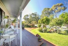13 Scarlet Gum Street Ulladulla NSW 2539 $629,000 This country style family home exudes both warmth and charm. Dado walls help frame each living room while the crackling fireplace entices you to settling in for the rest of the day. Situated on a corner block and surrounded by a white picket fence and mature gardens you really get a sense of peace when you walk into this property. * four large bedrooms all with built-in robes *master bedroom with ensuite *main bathroom with soaking bath and separate toilet *covered and enclosed rear outdoor entertaining area *double garage with huge loft style storage area *front deck with bull nose verandah *2 large rear sheds *fully fenced front and rear yard *air-conditioning *beautiful street appeal and well worth a visit Features • Air Conditioning • Built In Robes • Convenient Location • Corner Block • Deck • Dishwasher • En Suite • Established Gardens • Fireplace • Fully Fenced • Shed • Street Appeal..