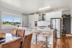 12 Cloudwalk Drive Maleny QLD 4552 $699,000 Fresh and functional this architecturally styled home will appeal to someone who appreciates good quality. Step into the foyer that leads to a lovely living room - dining and contemporary white kitchen. Lots of light and pretty views. Plus the Butlers pantry (lots of storage) and a combined laundry and airing room are adjacent to the kitchen making it the ideal utility area. Very generous easterly facing covered deck expands the living and entertainment area. Upstairs the Master bedroom looks out over the deck. Ah! morning sunshine (Ensuite & WIR). 3 additional bedrooms and a family bathroom cater for family or guests. Throughout the home are beautiful Tasmanian Oak polished timber floors. High planing ceilings are on the upper level providing a lovely airy environment. The expansive exterior decks and the garage floor are all hardwood. There is potential under the house to build in further rooms subject to council approval. Lovely country views of lush green pasture and neatly landscaped grounds add to the ambience of this home. No neighbours either side. Double car garage. Walk to Maleny Township. Beautifully presented awaiting a new owner. Call Geoff Wells 0418787060